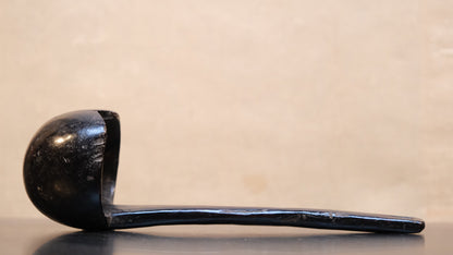 Close-up of Philippine folk ladle surface showing natural material aging