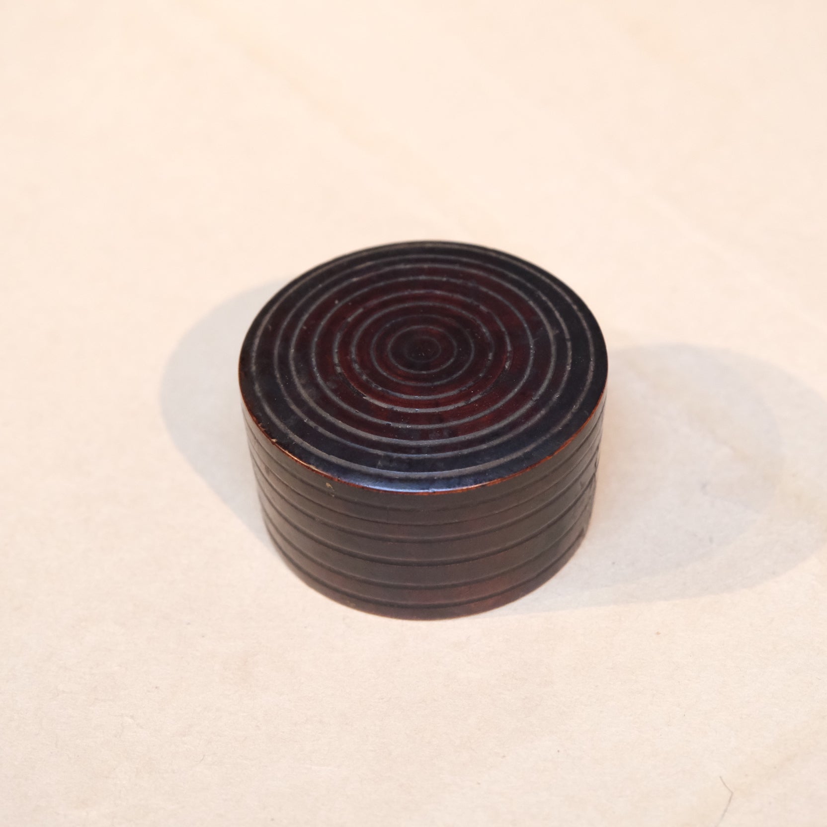 Turned wooden perfume container with fitted lid, lathe-worked object