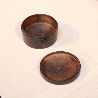 Full view of Japanese turned wooden perfume container with screw lid
