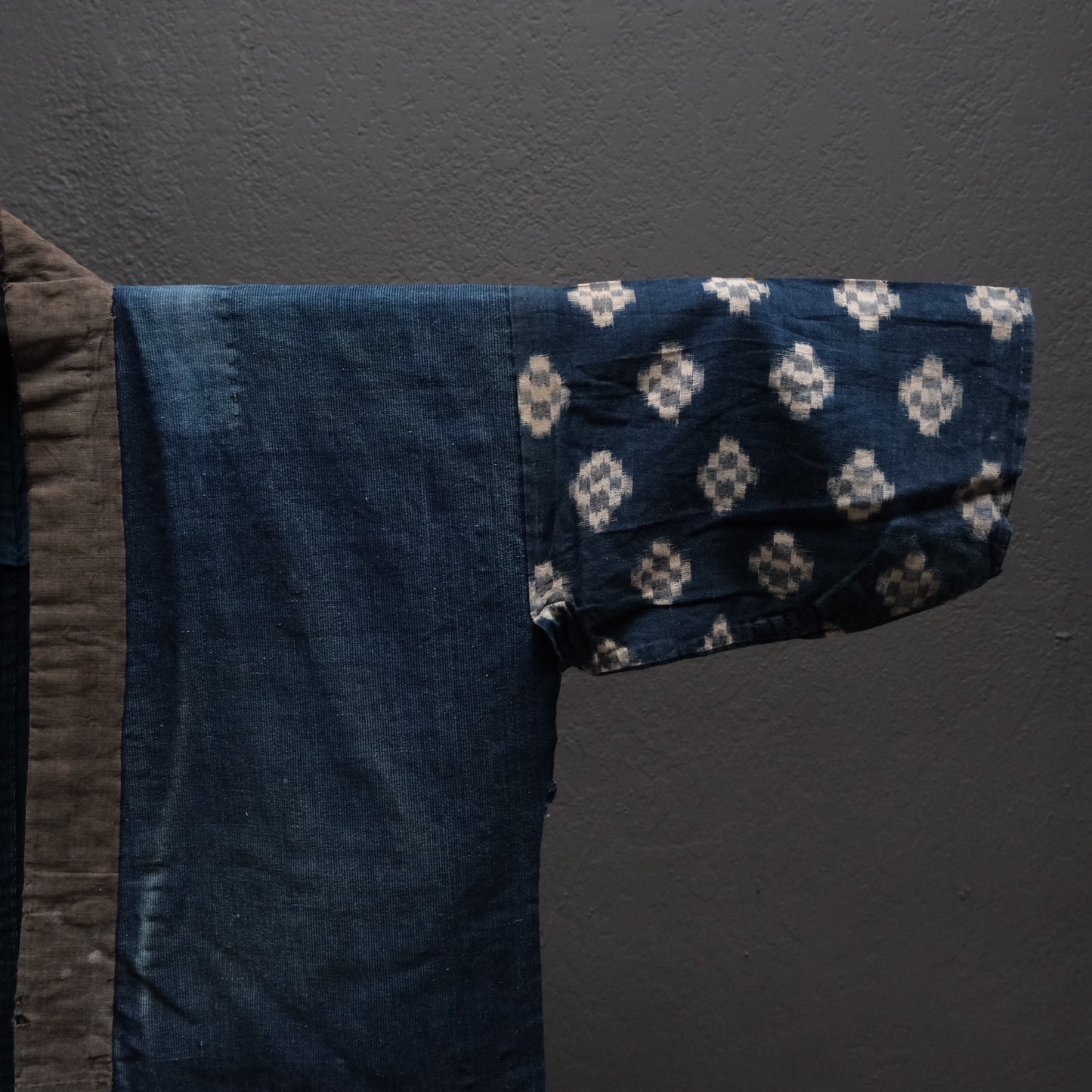 Close-up of pieced indigo cotton textile construction on noragi work kimono