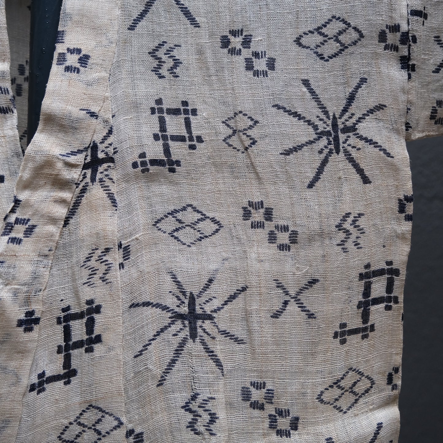 Close-up of stencil-dyed pattern on child's ramie nettle fiber summer kimono