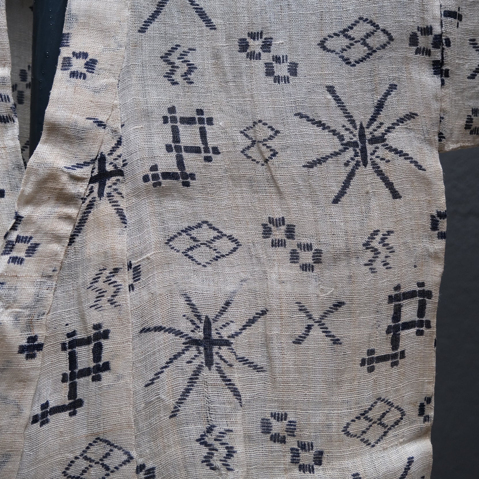 Close-up of stencil-dyed pattern on child's ramie nettle fiber summer kimono