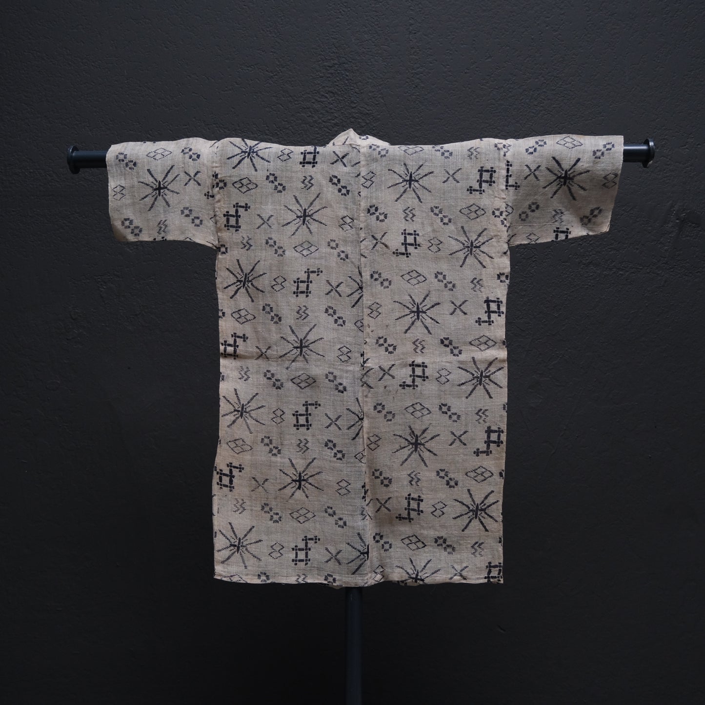 Japanese child's ramie summer kimono side view showing Okinawan stencil-dyed motifs