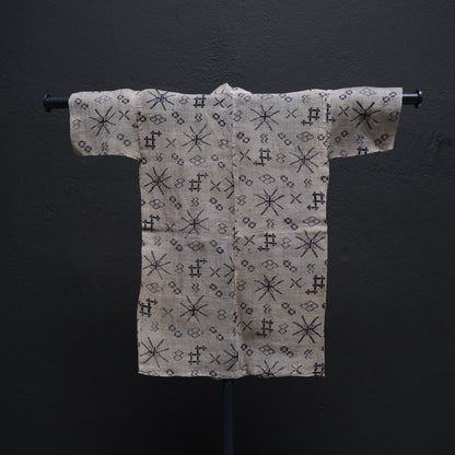 Japanese child's ramie summer kimono side view showing Okinawan stencil-dyed motifs