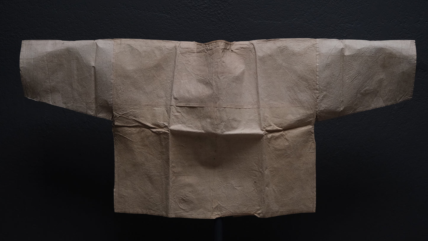 Damage and tear detail on Edo period Japanese kamiko paper undershirt