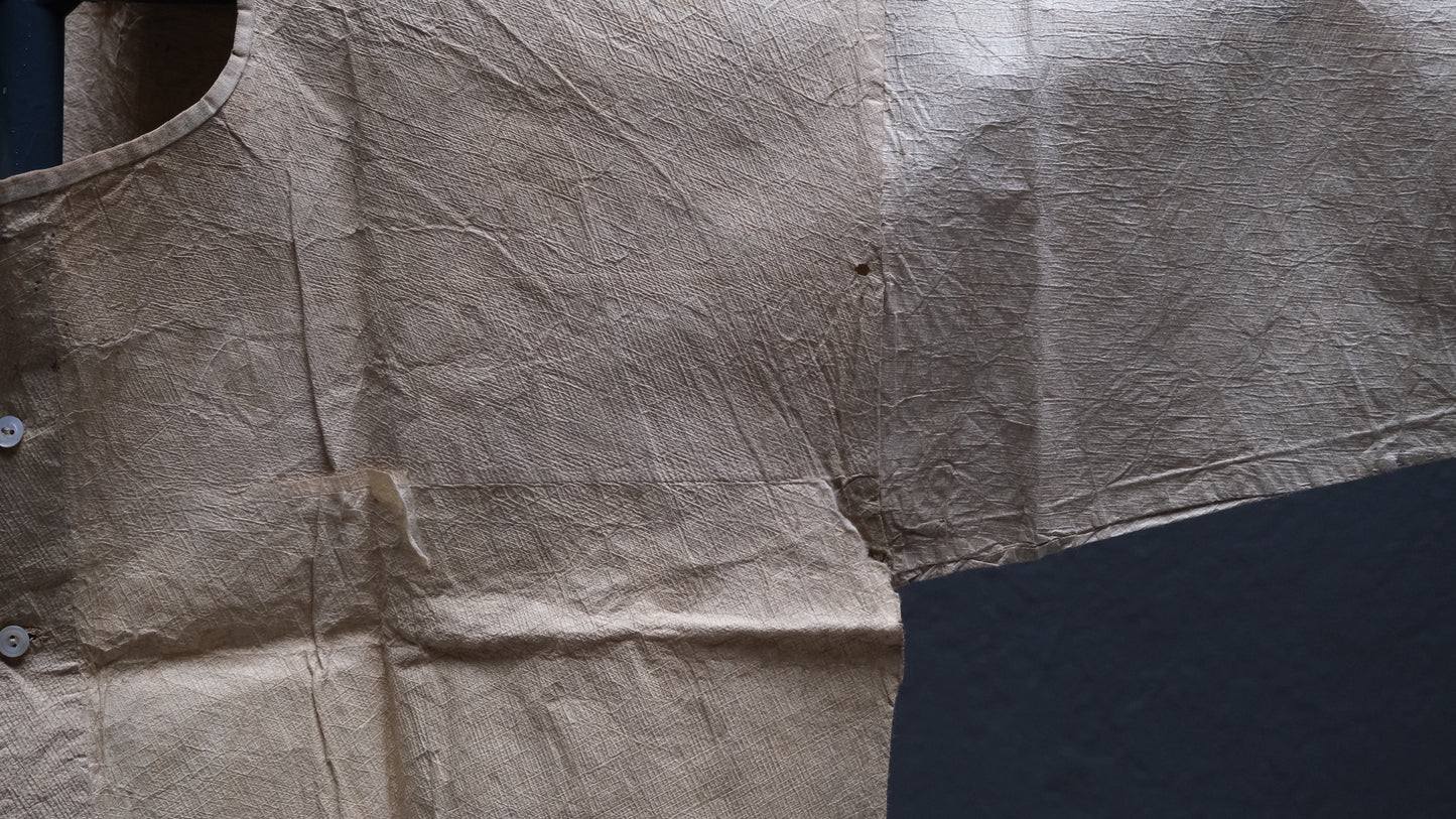 Alternate angle of Japanese kamiko paper garment showing washi paper surface