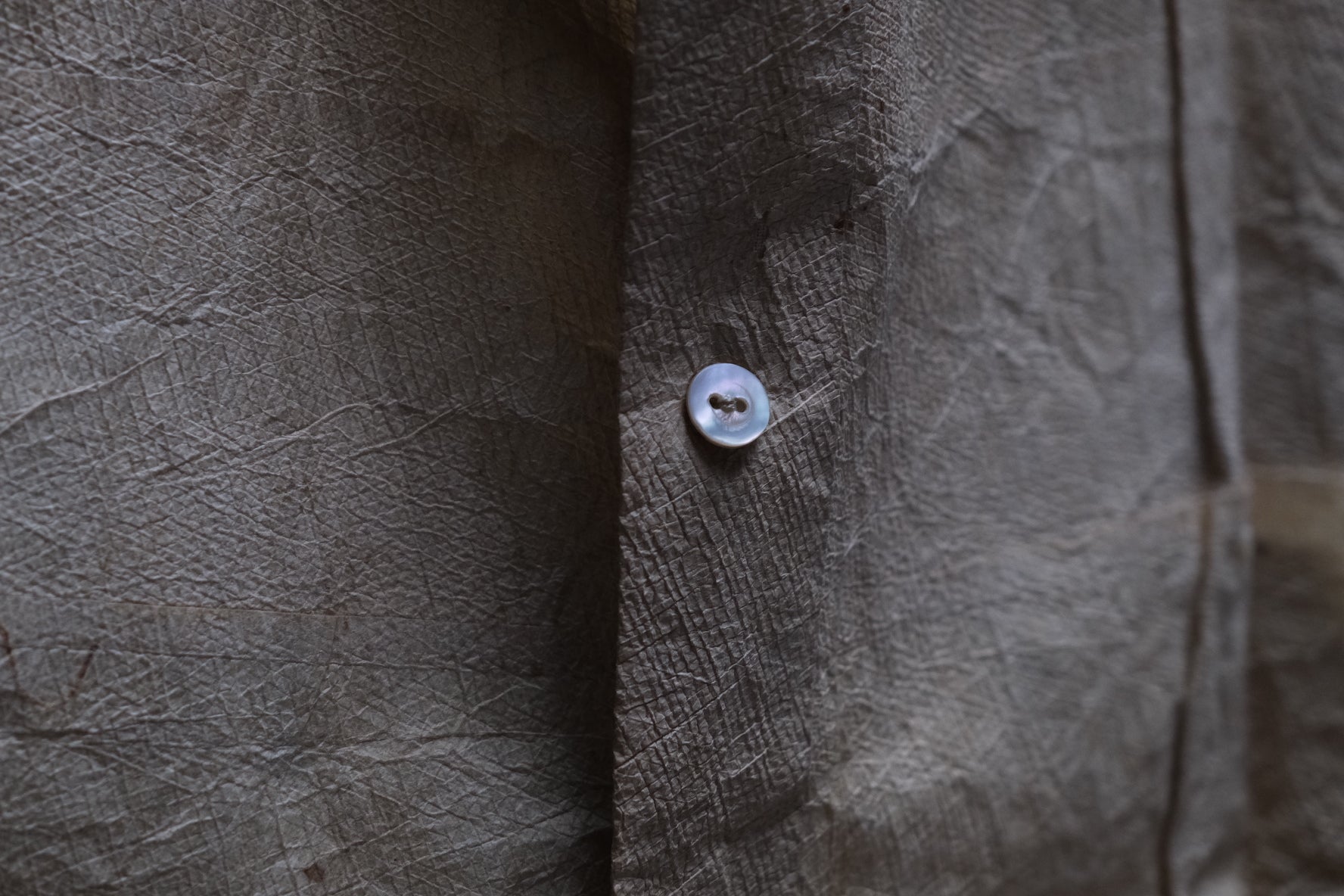 Close-up of subtle texture and quiet elegance of Edo period kamiko paper shirt