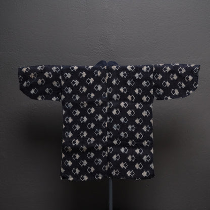 Full spread of Japanese double ikat robe showing woven design