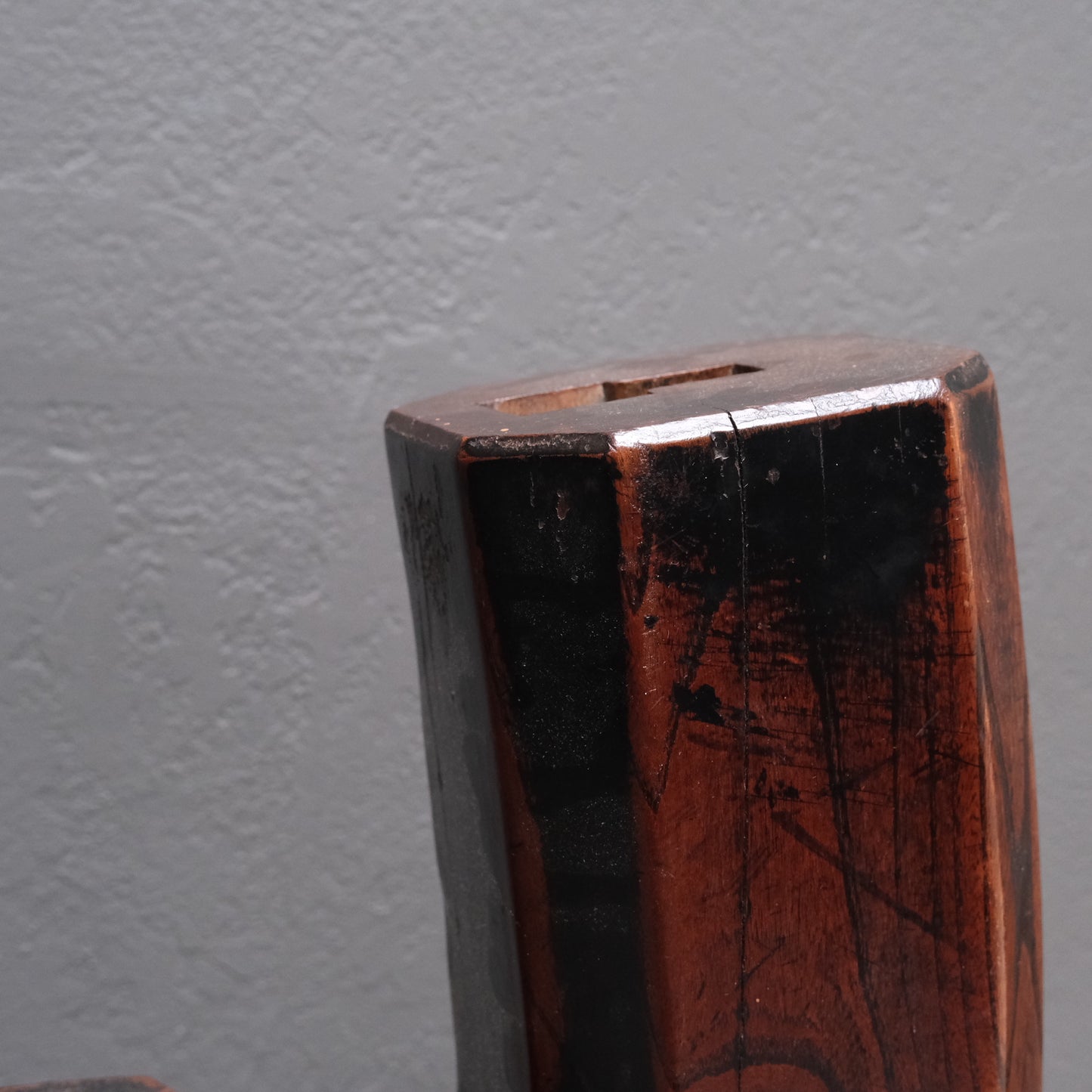 Detail of Ebisu peaked cap-shaped form on Japanese adjustable hearth hook
