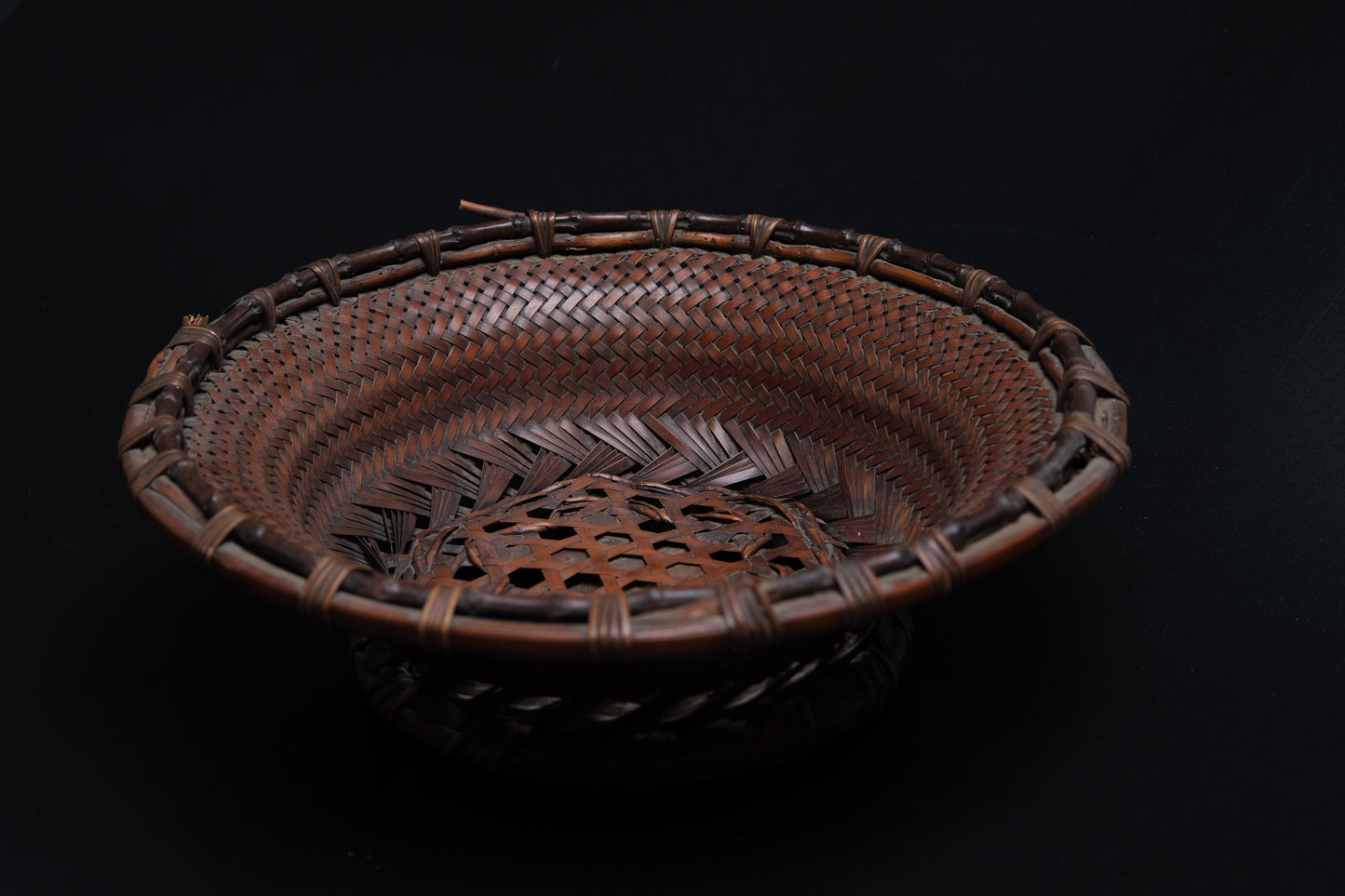 Close-up of hexagonal plaiting in center field of fine bamboo flat basket