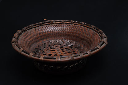 Close-up of hexagonal plaiting in center field of fine bamboo flat basket