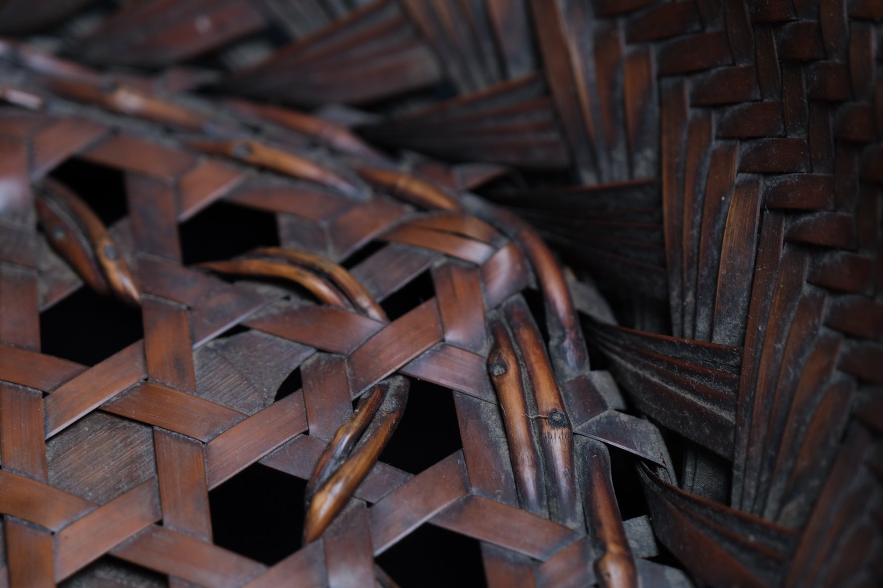 Alternate angle of fine Japanese bamboo flat basket by skilled artisan