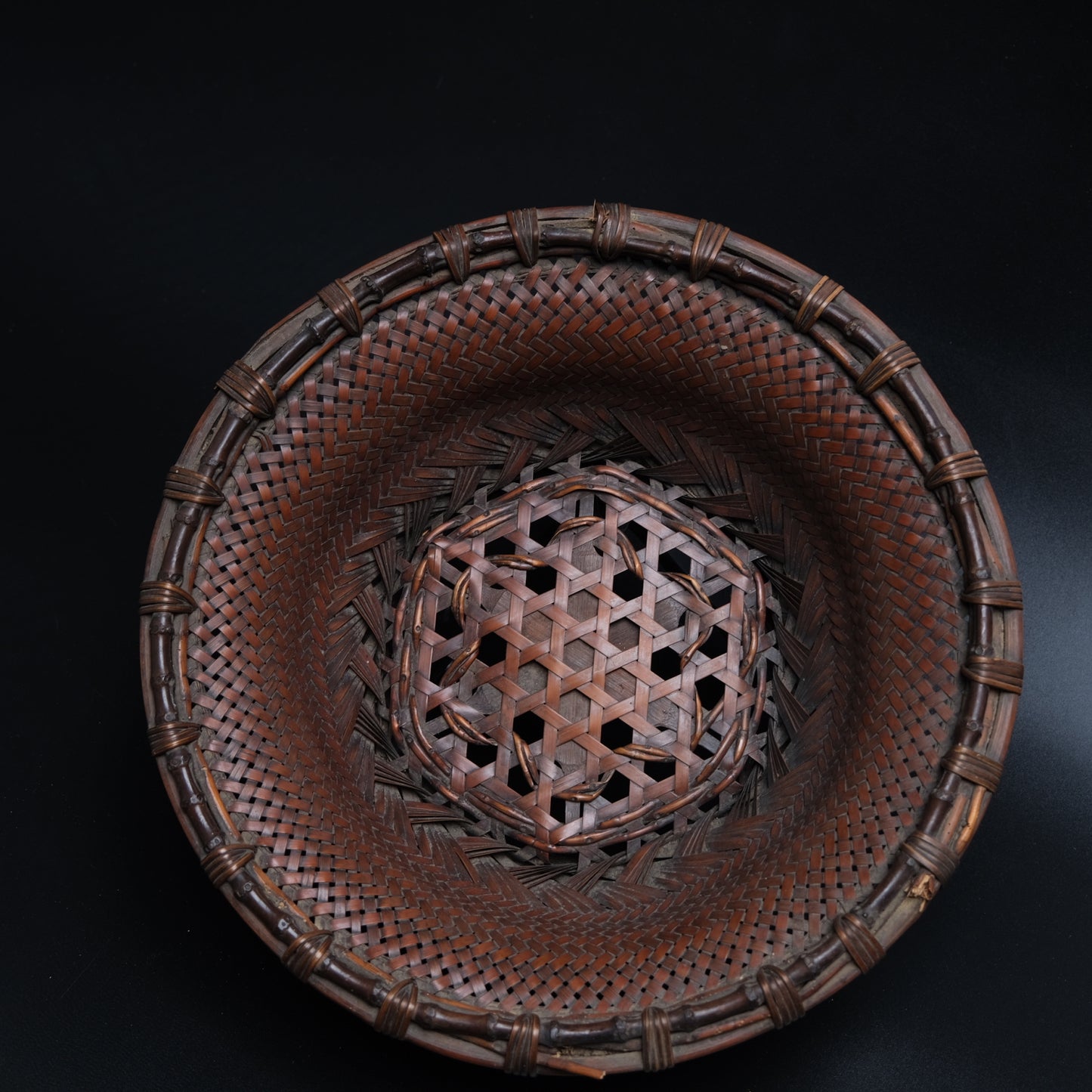 Fine Japanese bamboo flat basket side view showing hexagonal plaiting