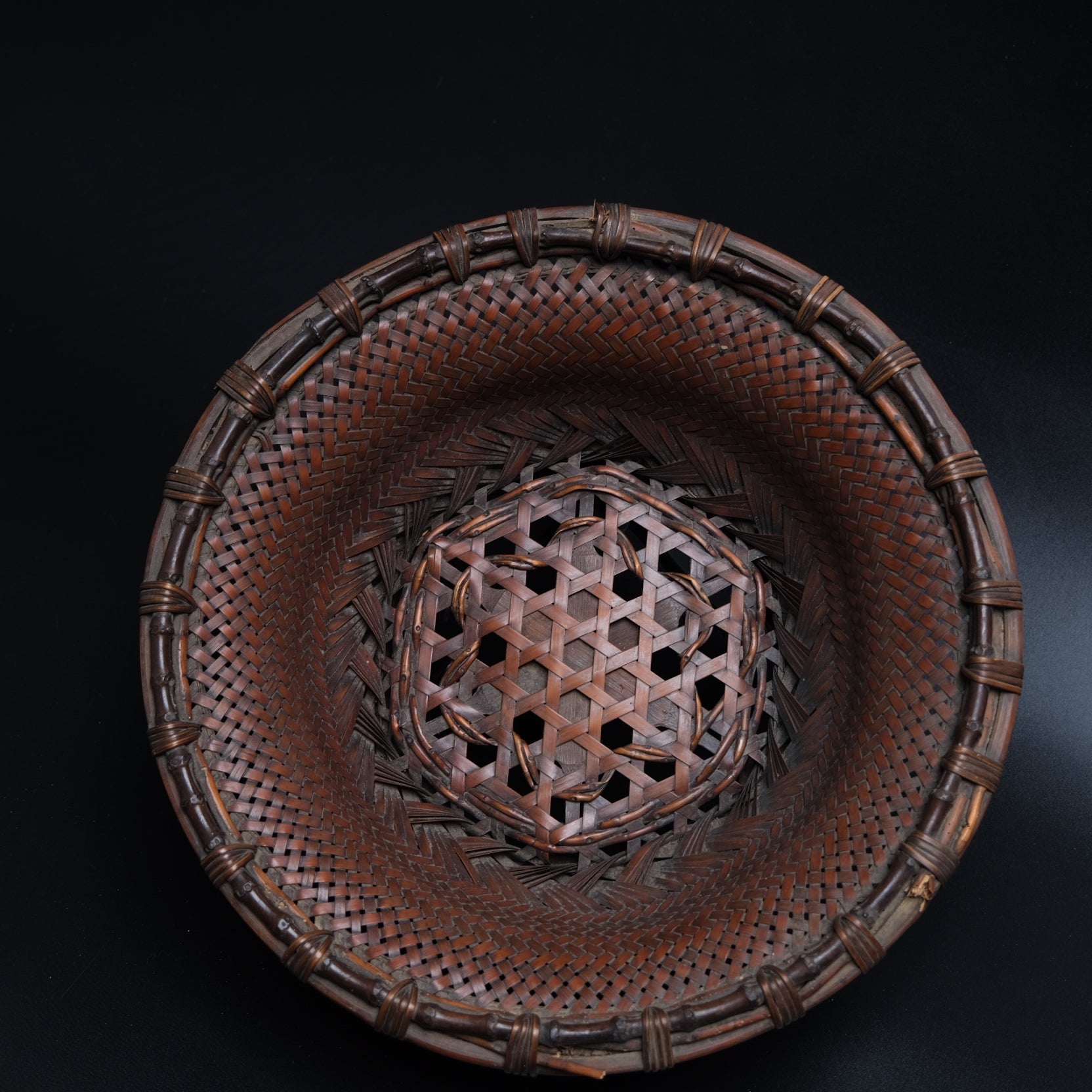 Fine Japanese bamboo flat basket side view showing hexagonal plaiting