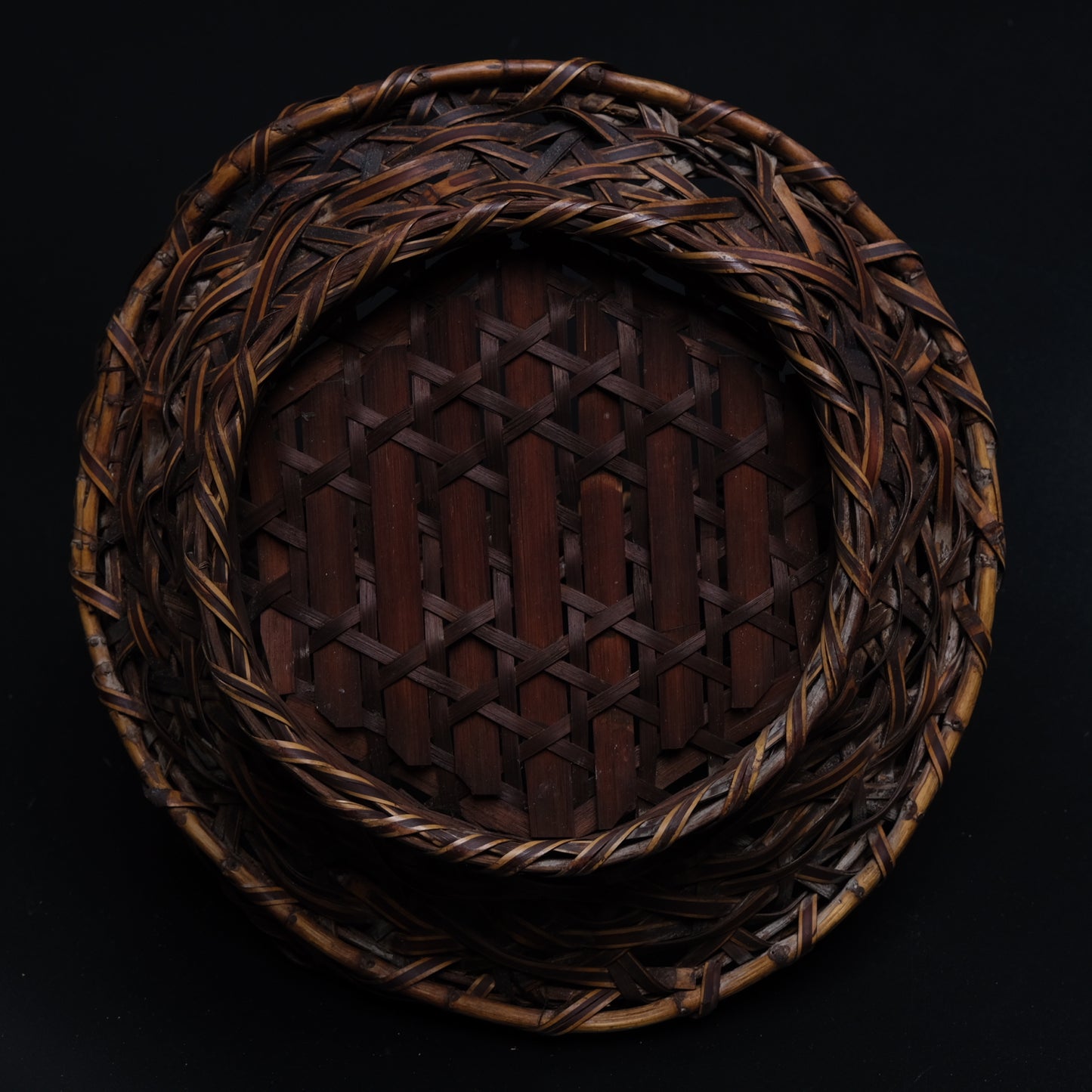 Detail of bamboo material and surface on unsigned fine Japanese flat basket