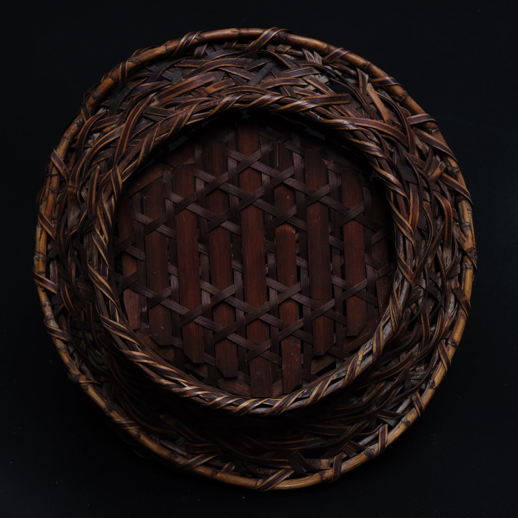 Detail of bamboo material and surface on unsigned fine Japanese flat basket