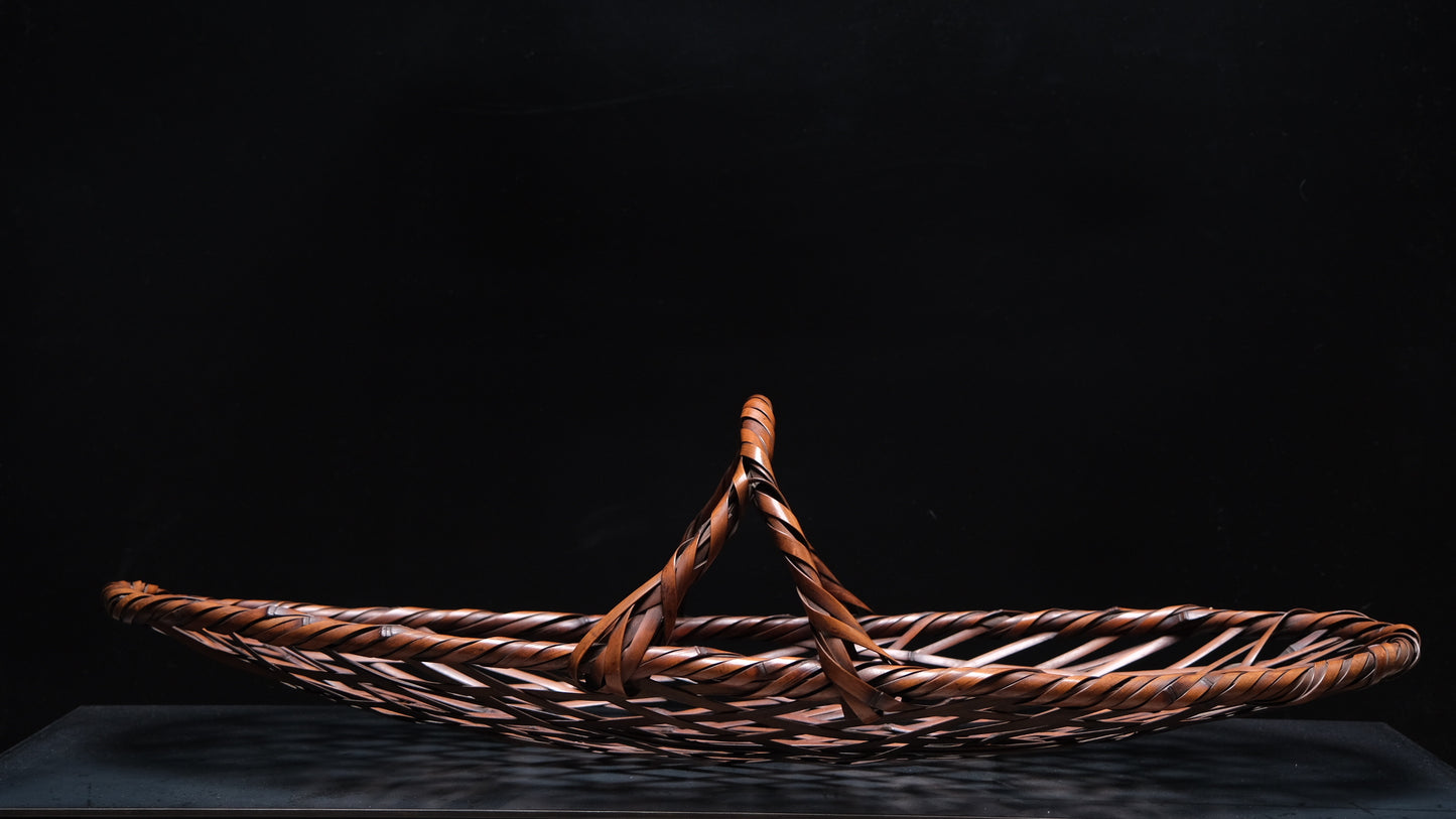Detail of madake bamboo weave on signed elliptical Japanese basket