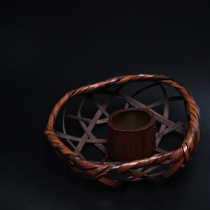 Japanese bamboo basket with woven open weave and handle
