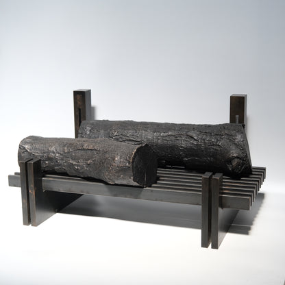 Fireplace grate close-up showing iron construction and form