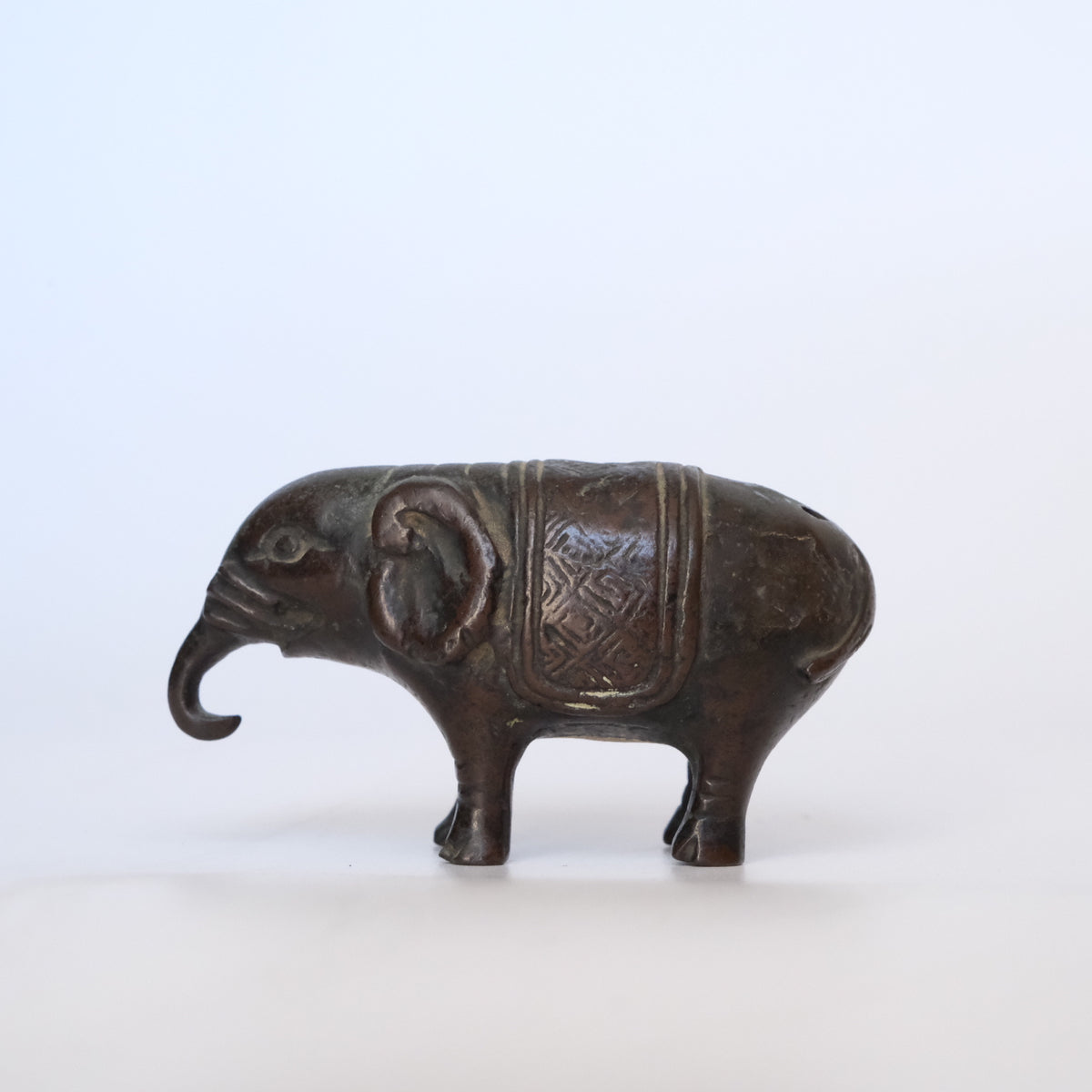 Small cast bronze elephant water dropper (suiteki) with incised caparison, view 8 of 8