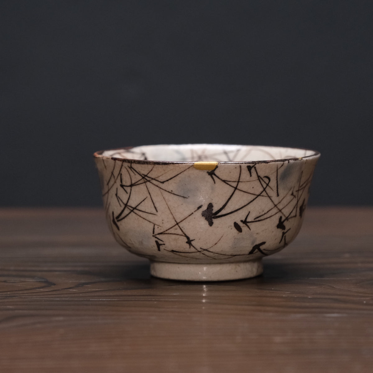 Kyo-yaki bowl with brushed susuki grass design and gold kintsugi repairs, view 3 of 10