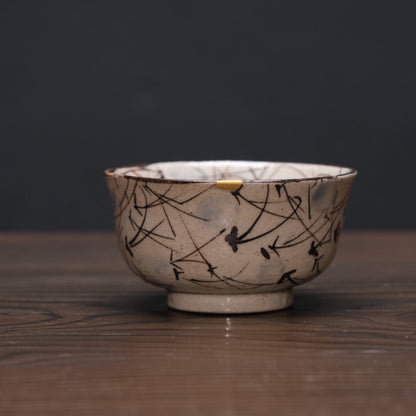 Kyo-yaki bowl with brushed susuki grass design and gold kintsugi repairs, view 3 of 10