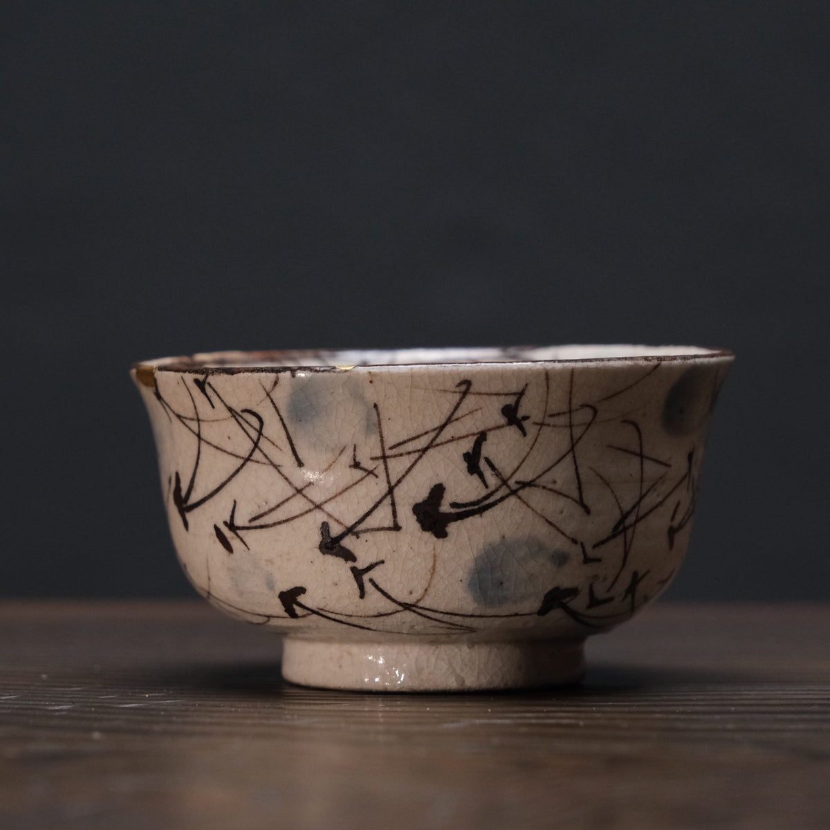 Kyo-yaki bowl with brushed susuki grass design and gold kintsugi repairs, view 2 of 10