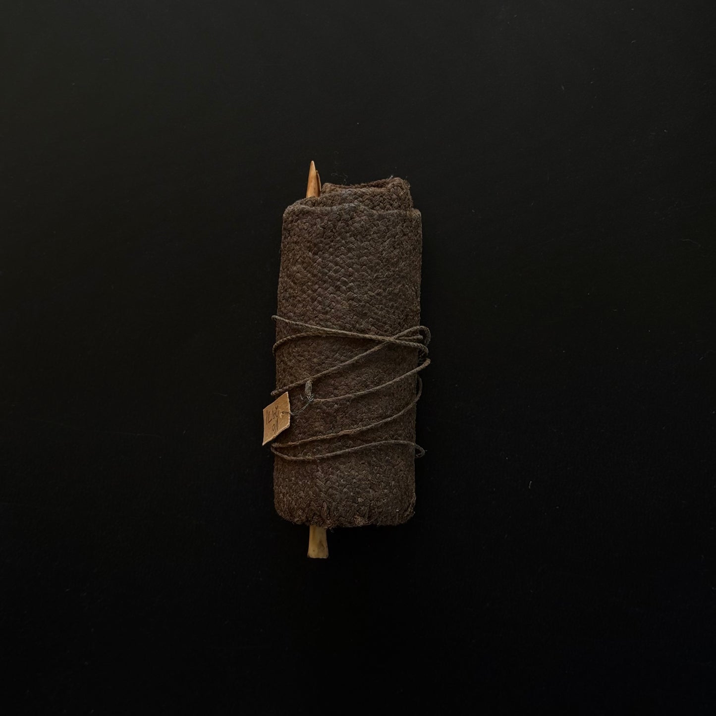 19th century Oceanic pandanus sewing kit side view showing woven fiber case
