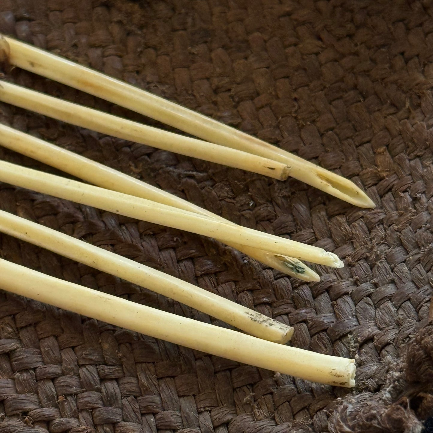 Close-up of woven pandanus fiber construction on Oceanic sewing kit case