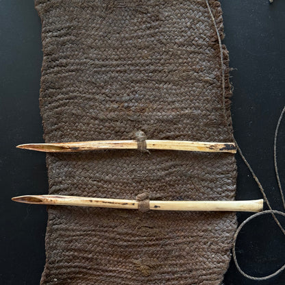 Bird-bone needle detail showing fine polish on 19th century Oceanic sewing kit