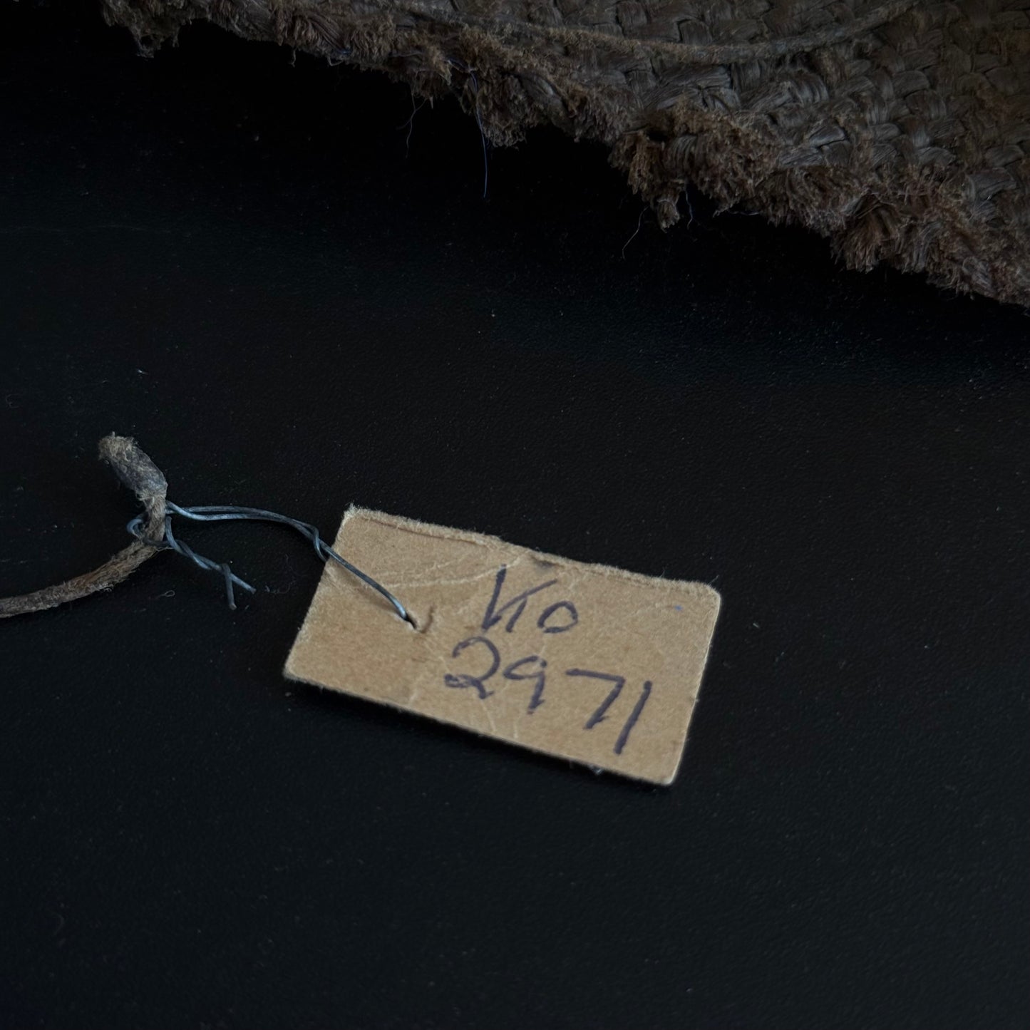 Small roll of handmade paper included with 19th century Oceanic sewing kit
