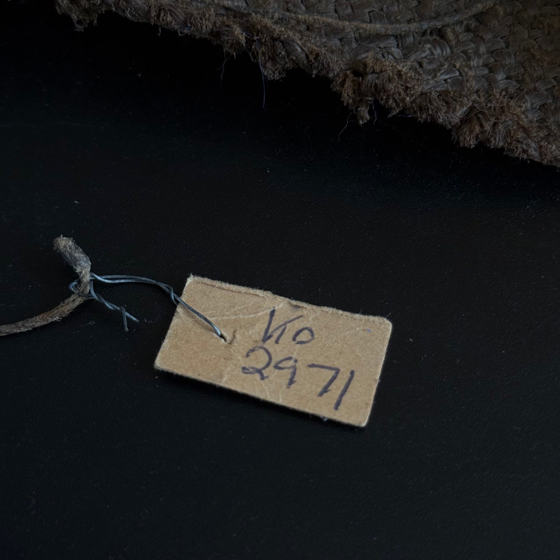 Small roll of handmade paper included with 19th century Oceanic sewing kit