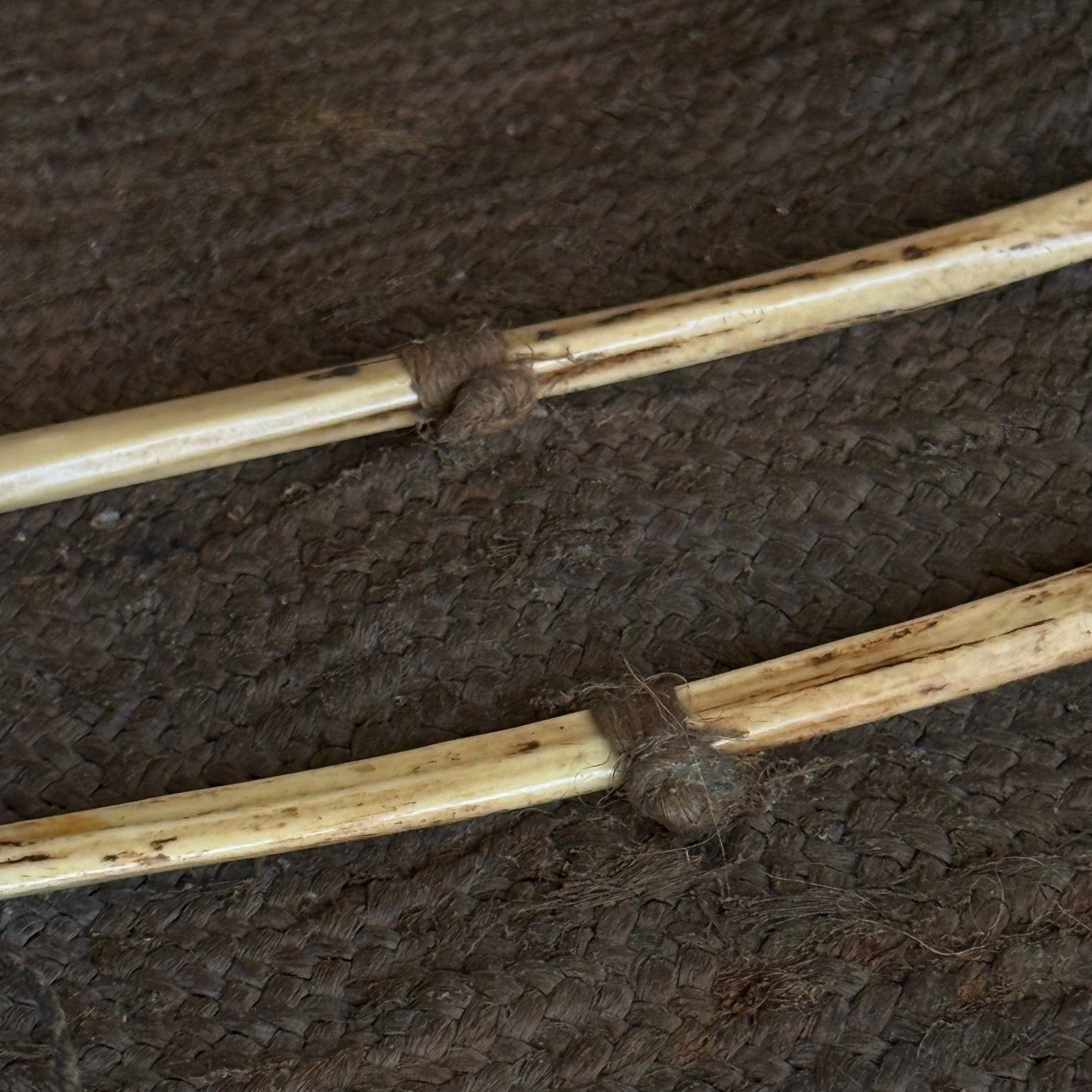 Full unrolled view of 19th century Oceanic pandanus sewing kit with needles