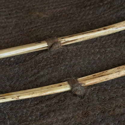 Full unrolled view of 19th century Oceanic pandanus sewing kit with needles