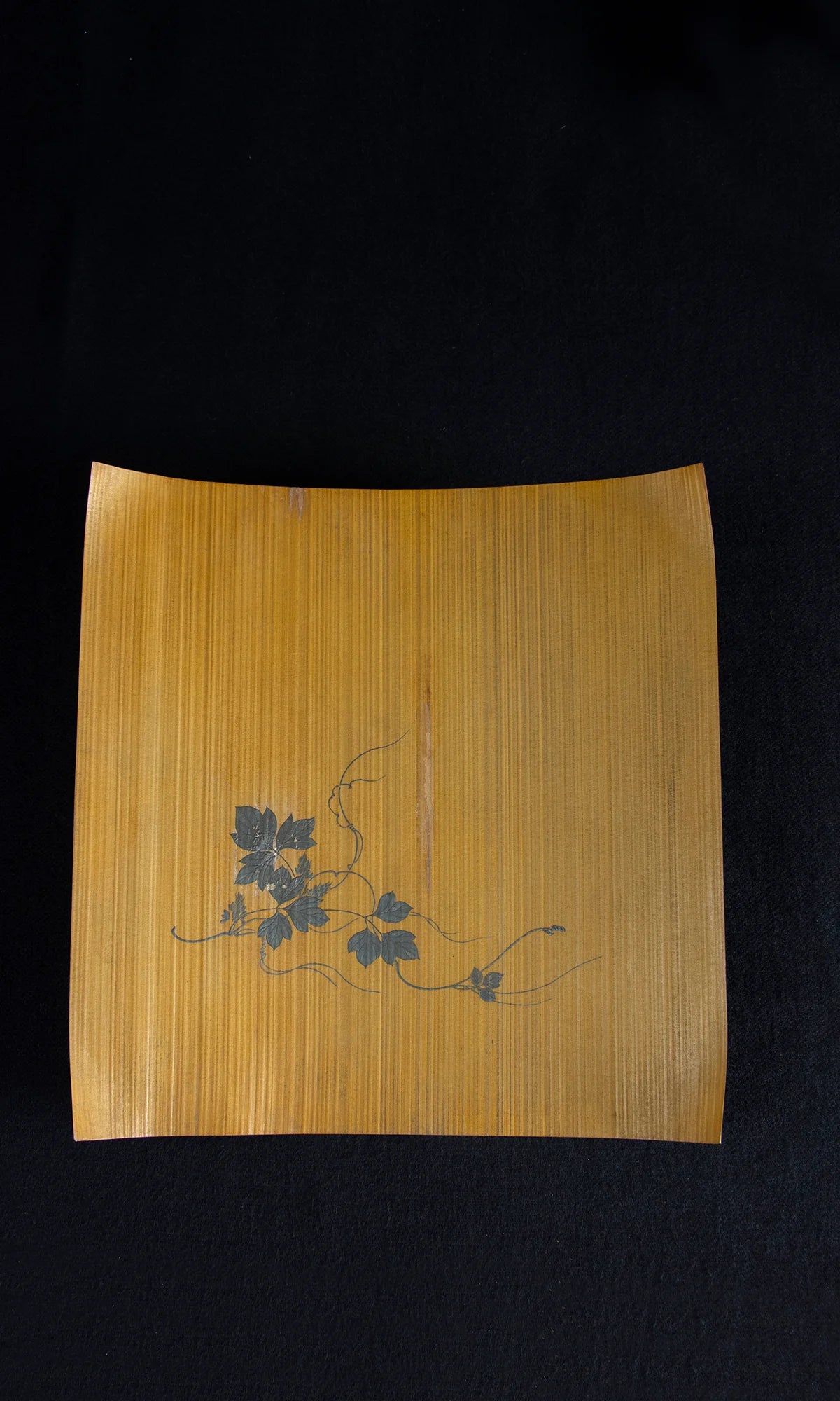 Detail of artist's seal on reverse of Japanese painted lacquer bamboo tray