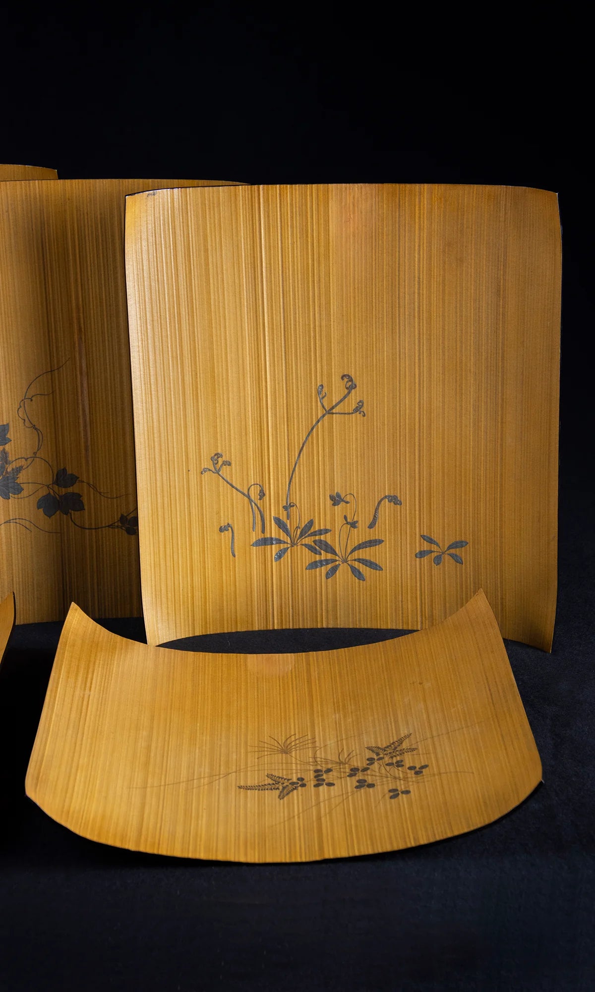 Alternate angle of Japanese large bent bamboo trays with lacquer painting